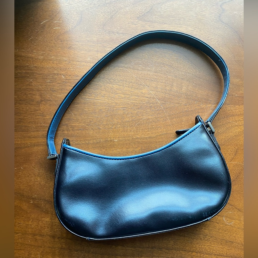 Black faux leather mini purse.